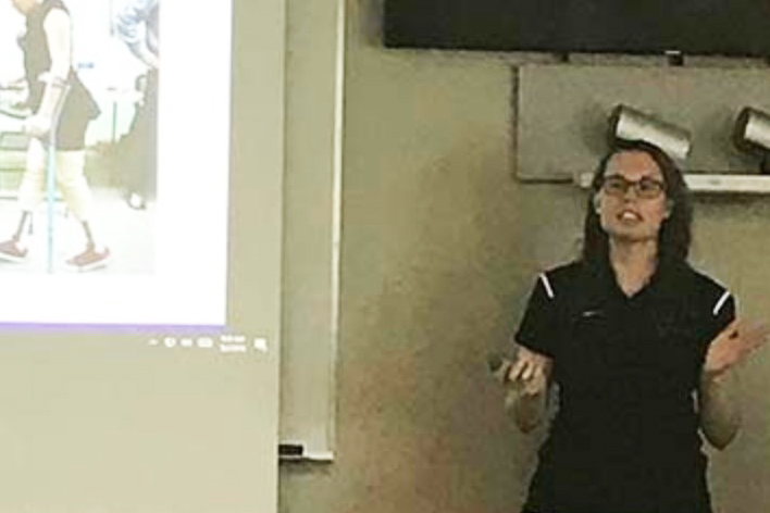 image of a woman giving a presentation