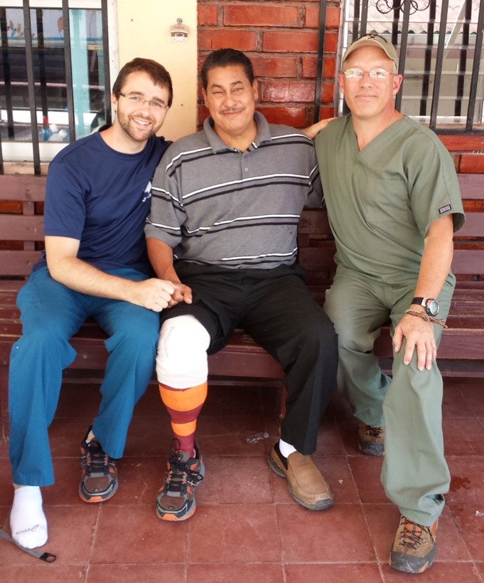 image of three men sitting on a bench